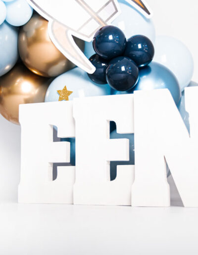 Cake smash photography: An adorable baby gleefully smashing a colorful birthday cake with their hands, surrounded by festive decorations and laughter, capturing the joy and excitement of their first birthday celebration.