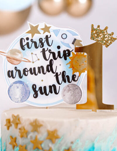 Cake smash photography: An adorable baby gleefully smashing a colorful birthday cake with their hands, surrounded by festive decorations and laughter, capturing the joy and excitement of their first birthday celebration.