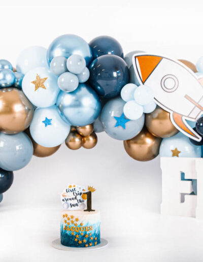 Cake smash photography: An adorable baby gleefully smashing a colorful birthday cake with their hands, surrounded by festive decorations and laughter, capturing the joy and excitement of their first birthday celebration.