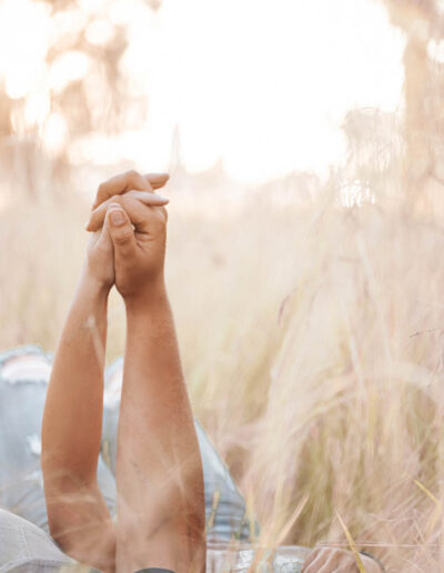 Couple photography: A romantic image featuring a loving couple, embracing or holding hands, with genuine smiles and laughter, set against a beautiful outdoor backdrop or cozy indoor setting, reflecting the bond and affection between them.